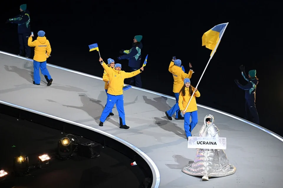 Ukraine demands the IOC investigate why a Russian woman carried Ukraine sign at the Olympics opening